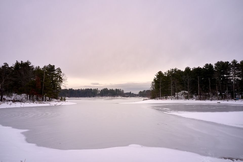 The lake, still, with hills behind